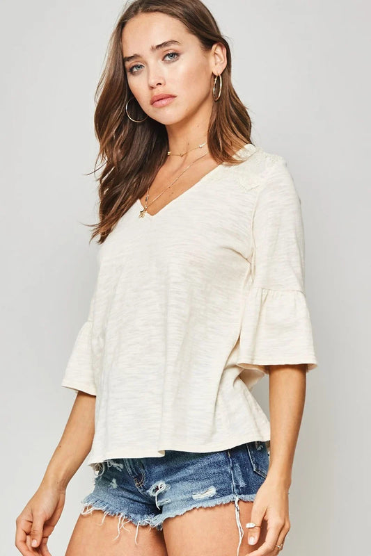 A Knit Top With Deep V Neckline And Yoke Design